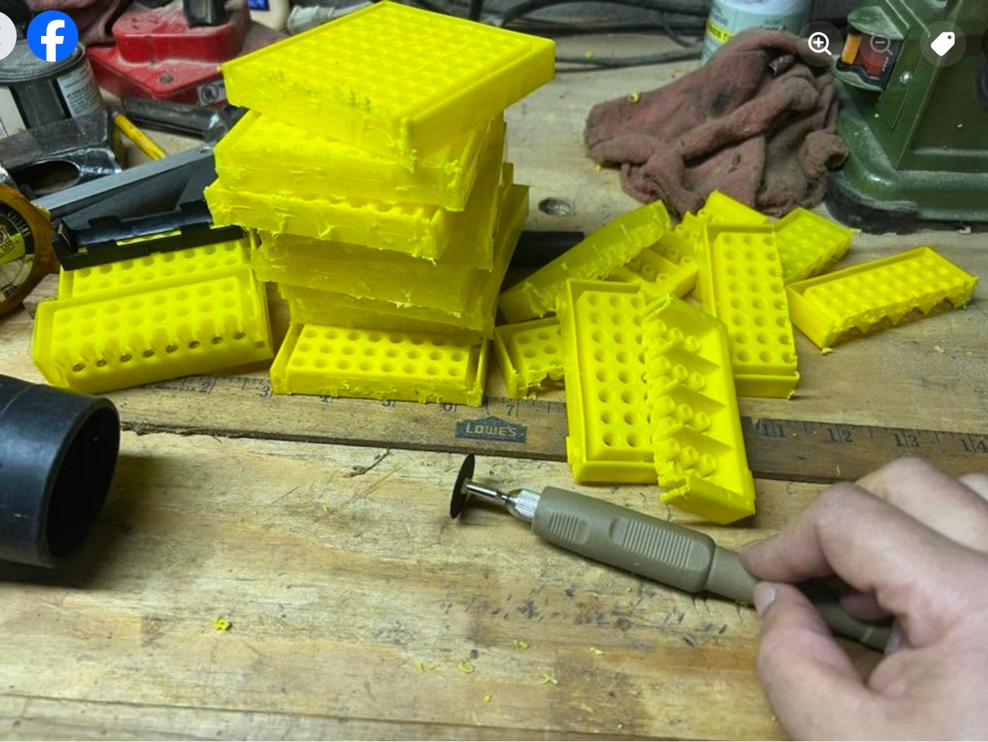 Cutting a yellow rack with a rotary tool and cut-off wheel